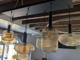 five lights hanging from the ceiling in a room