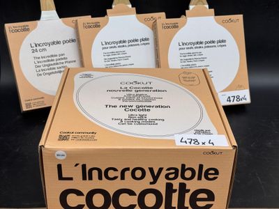 trois boîtes de lait chocolaté posées sur une table