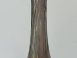 a glass vase that is sitting on a table