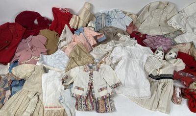 a pile of clothes and clothes that are on a table