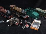 a lot of different toy trains on a black background