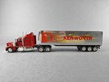 a toy truck with a trailer on the back of it