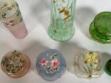 many glass vases that are sitting on a table