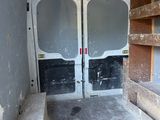 a white van that has two doors open in the back of it