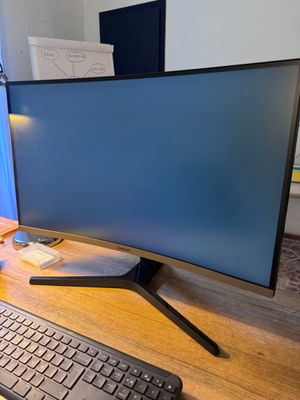 an image of a computer desk with a keyboard and monitor