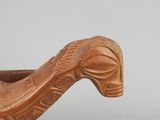 a wooden boat that is sitting on a table
