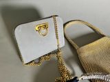 two purses that are next to each other on a table