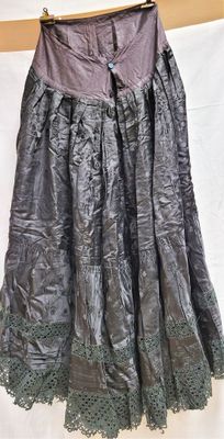 a close up of a skirt on a hanger on a wall