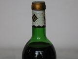 a bottle of wine that is sitting on a table