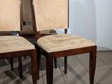 two chairs sitting next to each other on a tiled floor