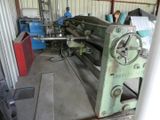 a woman working on a machine in a factory