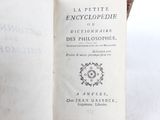 an open book with a picture of a clock on it