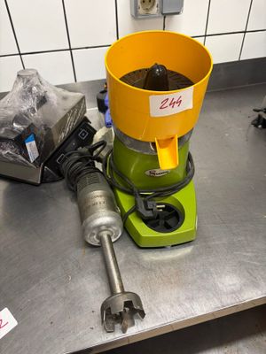 a yellow bucket sitting on top of a green machine