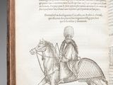 an old book with a drawing of a man riding a horse