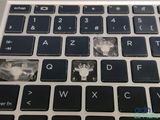 a close up of a broken keyboard on a laptop