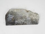 a rock that has been placed on a white surface