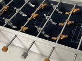 a metal foo foo foo table with gold and silver decorations on it
