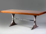a wooden table with metal legs and a wooden top