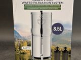 the box of a water filtrator is open on a table