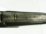 a close up of a knife on a white surface