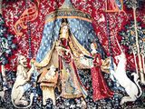 a picture of a tapestry with a lady and two dogs