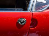 a close up of a car door handle with a sticker on it