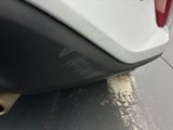 a close up of a car ' s rear bumper and exhaust pipe