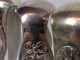 three spoons that are sitting on a table