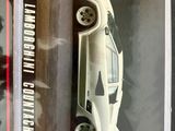 a picture of a white car and a black and white picture of a man