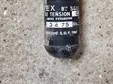 a black fire extinguisor on the concrete floor