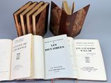 three open books sitting on top of a table next to each other