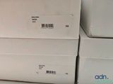 several white boxes stacked on top of each other in a store