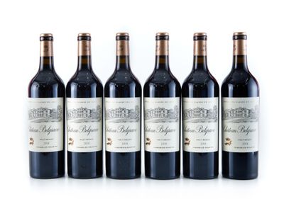 six bottles of red wine lined up on a white surface