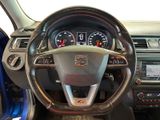 dashboard of a car with a steering wheel and dashboard gauges