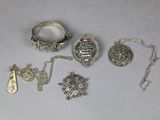 a lot of silver items that are on the table