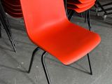 a lot of chairs that are sitting in a room