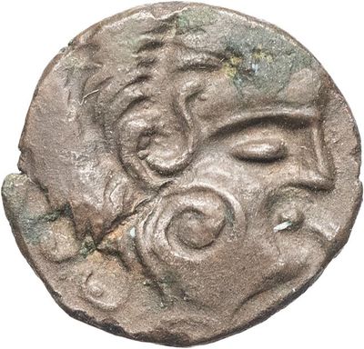 une pièce d'argent sur laquelle figurent un visage et une tête