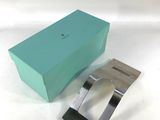 a close up of a watch in a box on a table