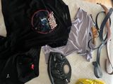 a lot of clothing and shoes on the bed