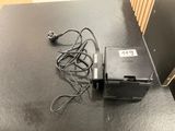 an image of a table with a printer and a charger on it