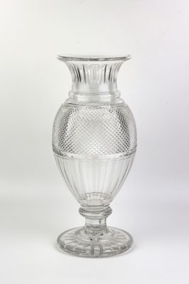 a glass vase that is sitting on a table