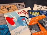 a lot of music books on the table
