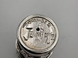 a close up of a coin sitting on top of a table
