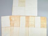 four pieces of old paper are folded on top of each other