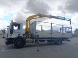 a white truck with a crane attached to it ' s back