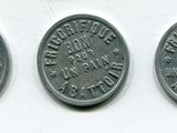three quarters of the same type of coin are shown on a white surface