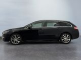 a picture of a black car parked in a garage