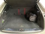 a bag in the trunk of a car with the back door open
