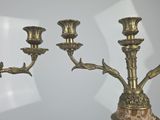 three candles that are sitting on a table