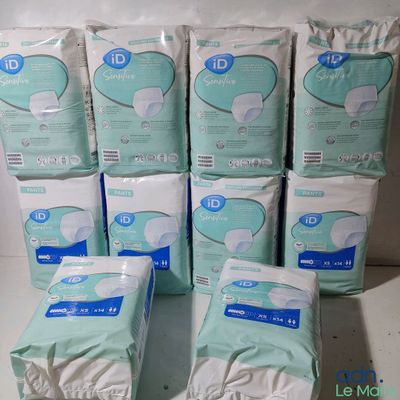 six packs of disposable baby diapers stacked on top of each other
